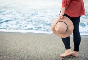person holding hat